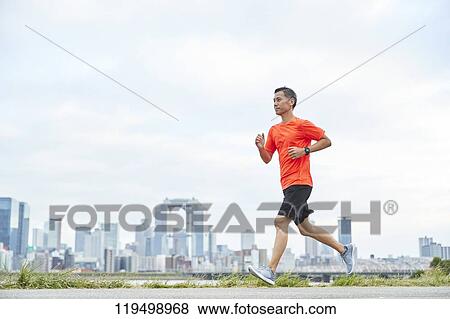 Mature Japanese man running downtown Osaka, Japan View Large Photo Image Stock Photo - Mature Japanese man running downtown Osaka, Japan. Fotosearch
