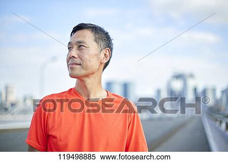 Mature Japanese man running downtown Osaka, Japan View Large Photo Image Stock Photography - Mature Japanese man running downtown Osaka, Japan. Fotosearch