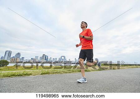 Mature Japanese man running downtown Osaka, Japan View Large Photo Image Stock Photography - Mature Japanese man running downtown Osaka, Japan. Fotosearch