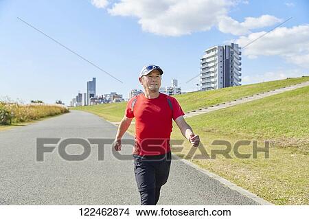 Mature Japanese man training downtown View Large Photo Image Picture - Mature Japanese man training downtown. Fotosearch