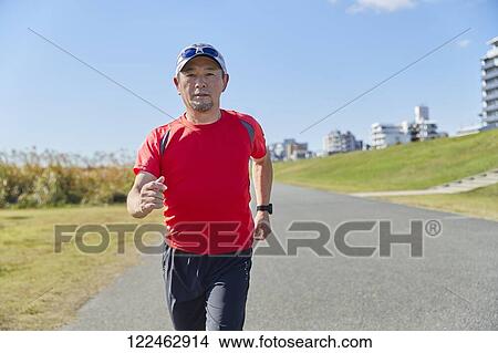 Mature Japanese man training downtown View Large Photo Image Picture - Mature Japanese man training downtown. Fotosearch