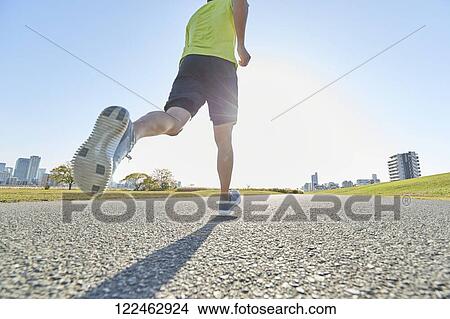Picture - Mature Japanese man training downtown. Fotosearch