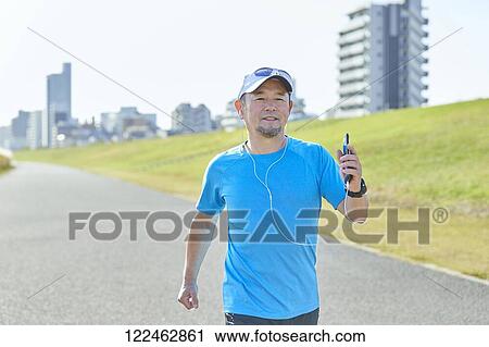 Mature Japanese man training downtown View Large Photo Image Stock Image - Mature Japanese man training downtown. Fotosearch