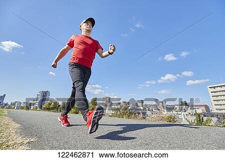 Mature Japanese man training downtown View Large Photo Image Stock Image - Mature Japanese man training downtown. Fotosearch