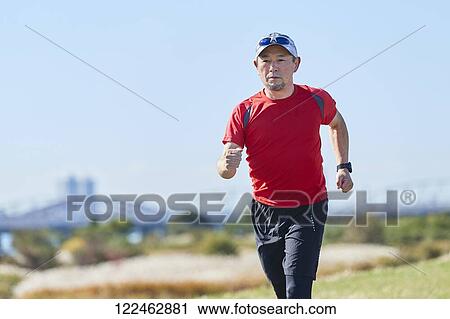 Mature Japanese man training downtown View Large Photo Image Stock Image - Mature Japanese man training downtown. Fotosearch