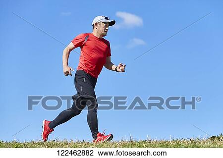 Mature Japanese man training downtown View Large Photo Image Stock Image - Mature Japanese man training downtown. Fotosearch