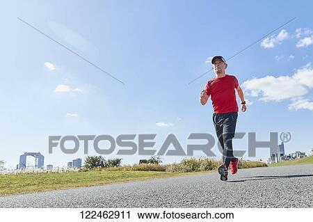 Mature Japanese man training downtown View Large Photo Image Stock Image - Mature Japanese man training downtown. Fotosearch