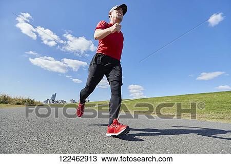 Mature Japanese man training downtown View Large Photo Image Stock Image - Mature Japanese man training downtown. Fotosearch