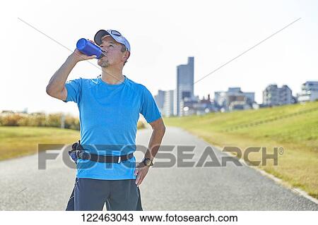 Mature Japanese man training downtown View Large Photo Image Stock Image - Mature Japanese man training downtown. Fotosearch