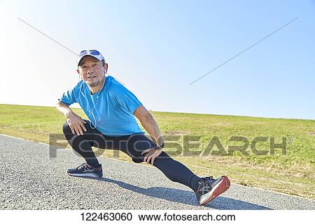 Mature Japanese man training downtown View Large Photo Image Stock Image - Mature Japanese man training downtown. Fotosearch