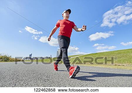 Mature Japanese man training downtown View Large Photo Image Stock Photo - Mature Japanese man training downtown. Fotosearch