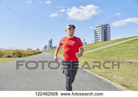 Mature Japanese man training downtown View Large Photo Image Stock Photo - Mature Japanese man training downtown. Fotosearch