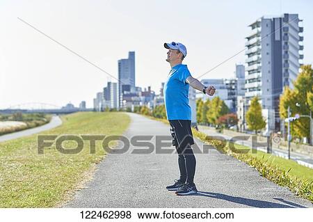 Mature Japanese man training downtown View Large Photo Image Stock Photo - Mature Japanese man training downtown. Fotosearch