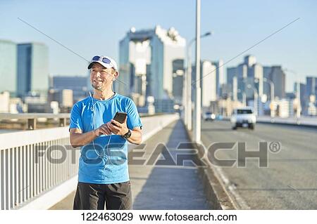 Mature Japanese man training downtown View Large Photo Image Stock Photo - Mature Japanese man training downtown. Fotosearch