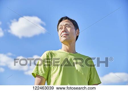 Mature Japanese man training downtown View Large Photo Image Stock Photo - Mature Japanese man training downtown. Fotosearch