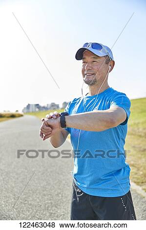 Mature Japanese man training downtown View Large Photo Image Stock Photo - Mature Japanese man training downtown. Fotosearch
