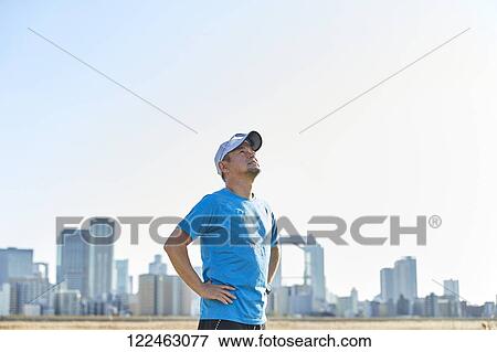 Mature Japanese man training downtown View Large Photo Image Stock Photo - Mature Japanese man training downtown. Fotosearch