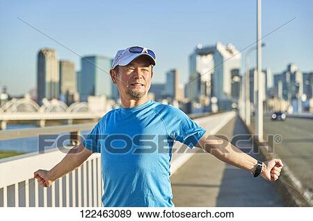 Mature Japanese man training downtown View Large Photo Image Stock Photo - Mature Japanese man training downtown. Fotosearch