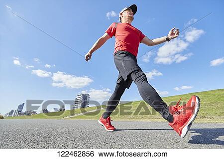 Mature Japanese man training downtown View Large Photo Image Stock Photograph - Mature Japanese man training downtown. Fotosearch