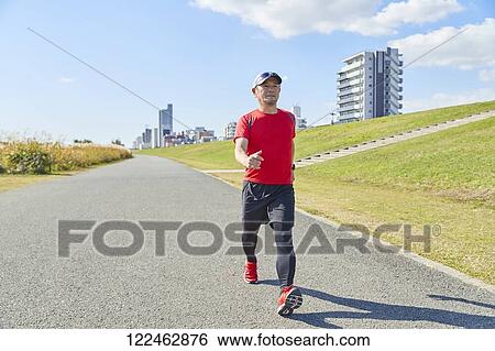 Mature Japanese man training downtown View Large Photo Image Stock Photograph - Mature Japanese man training downtown. Fotosearch