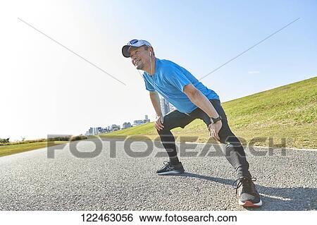 Mature Japanese man training downtown View Large Photo Image Stock Photograph - Mature Japanese man training downtown. Fotosearch