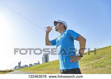 Mature Japanese man training downtown View Large Photo Image Stock Photograph - Mature Japanese man training downtown. Fotosearch