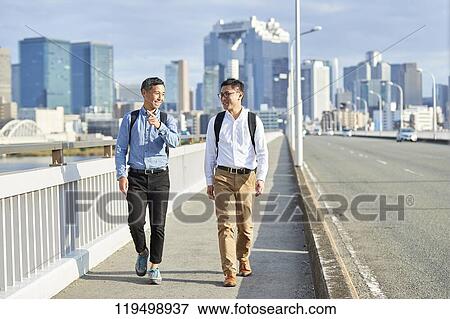 Stock Photo - Mature Japanese men downtown Osaka, Japan. Fotosearch