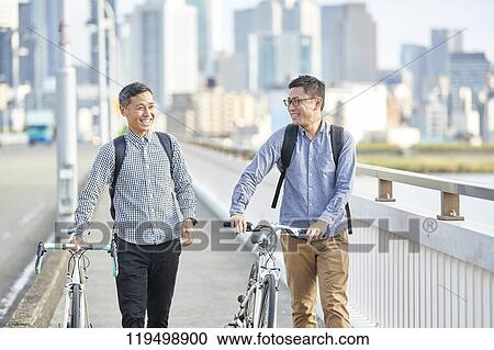 Mature Japanese men with bikes downtown Osaka, Japan View Large Photo Image Stock Image - Mature Japanese men with bikes downtown Osaka, Japan. Fotosearch