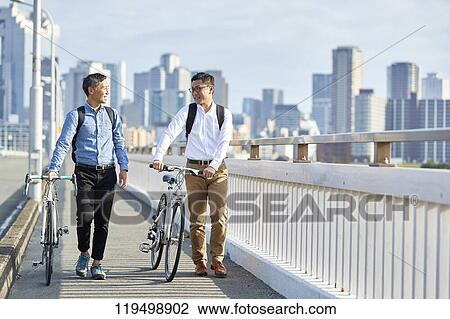 Mature Japanese men with bikes downtown Osaka, Japan View Large Photo Image Stock Image - Mature Japanese men with bikes downtown Osaka, Japan. Fotosearch