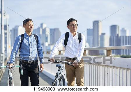 Mature Japanese men with bikes downtown Osaka, Japan View Large Photo Image Stock Image - Mature Japanese men with bikes downtown Osaka, Japan. Fotosearch