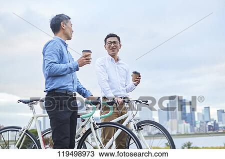 Mature Japanese men with bikes downtown Osaka, Japan View Large Photo Image Stock Image - Mature Japanese men with bikes downtown Osaka, Japan. Fotosearch