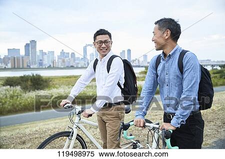 Mature Japanese men with bikes downtown Osaka, Japan View Large Photo Image Stock Photography - Mature Japanese men with bikes downtown Osaka, Japan. Fotosearch