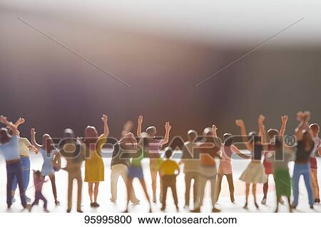 Miniature figures cheering View Large Photo Image Stock Image - Miniature figures cheering. Fotosearch