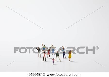 Miniature figures cheering View Large Photo Image Stock Image - Miniature figures cheering. Fotosearch