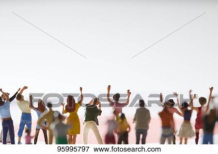 Miniature figures cheering View Large Photo Image Stock Photo - Miniature figures cheering. Fotosearch