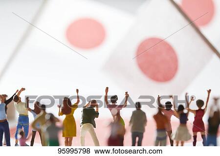 Miniature figures cheering View Large Photo Image Stock Photo - Miniature figures cheering. Fotosearch