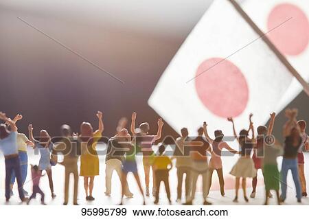 Miniature figures cheering View Large Photo Image Stock Photo - Miniature figures cheering. Fotosearch