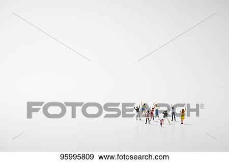 Miniature figures cheering View Large Photo Image Stock Photo - Miniature figures cheering. Fotosearch