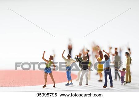Miniature figures cheering View Large Photo Image Stock Photography - Miniature figures cheering. Fotosearch