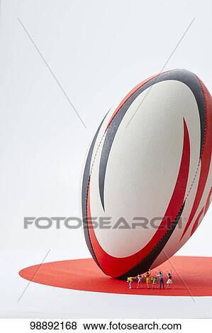 Stock Photo - Miniatures and rugby ball. Fotosearch