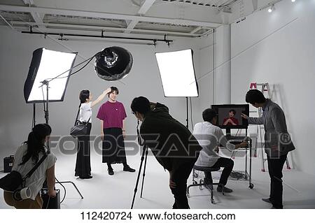 Picture - Model photo shoot in a studio. Fotosearch