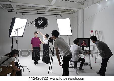Model photo shoot in a studio View Large Photo Image Stock Image - Model photo shoot in a studio. Fotosearch