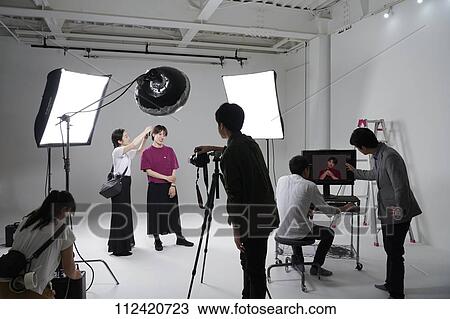 Model photo shoot in a studio View Large Photo Image Stock Image - Model photo shoot in a studio. Fotosearch