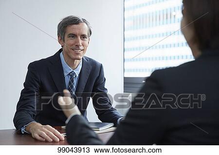 Multi-ethnic business people having meeting View Large Photo Image Stock Image - Multi-ethnic business people having meeting. Fotosearch