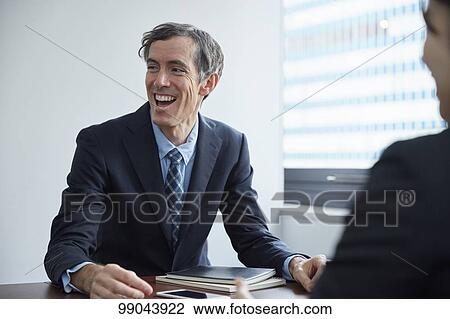 Multi-ethnic business people having meeting View Large Photo Image Stock Image - Multi-ethnic business people having meeting. Fotosearch