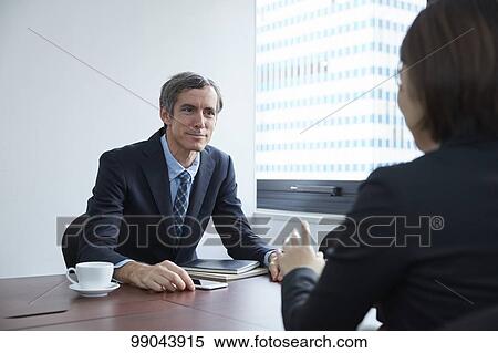 Multi-ethnic business people having meeting View Large Photo Image Stock Photography - Multi-ethnic business people having meeting. Fotosearch