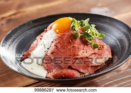 Stock Photo - Roast beef rice bowl. Fotosearch