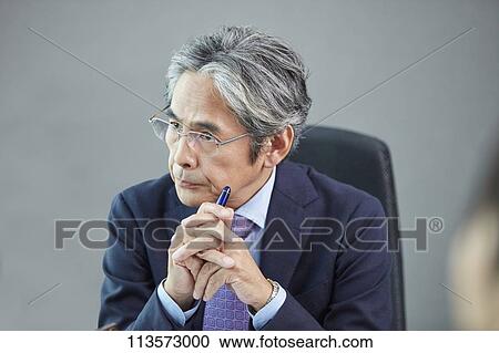 Stock Image - Senior Japanese businessman. Fotosearch