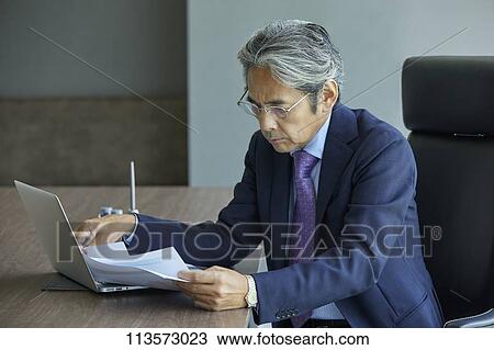 Stock Image - Senior Japanese businessman. Fotosearch