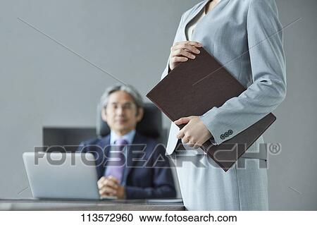 Senior Japanese businessman with his assistant View Large Photo Image Stock Image - Senior Japanese businessman with his assistant. Fotosearch